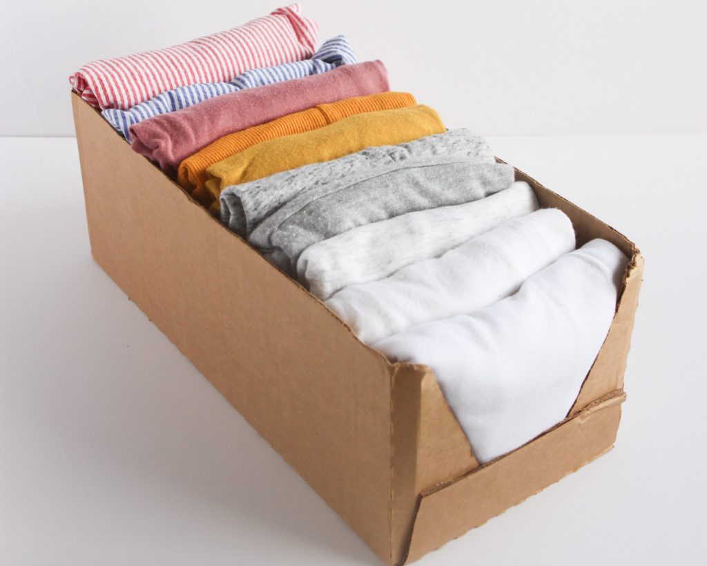 Closet organization tip 7: Use product packaging and grocery boxes as clothes storage - 7 tips for small closet organization on a budget