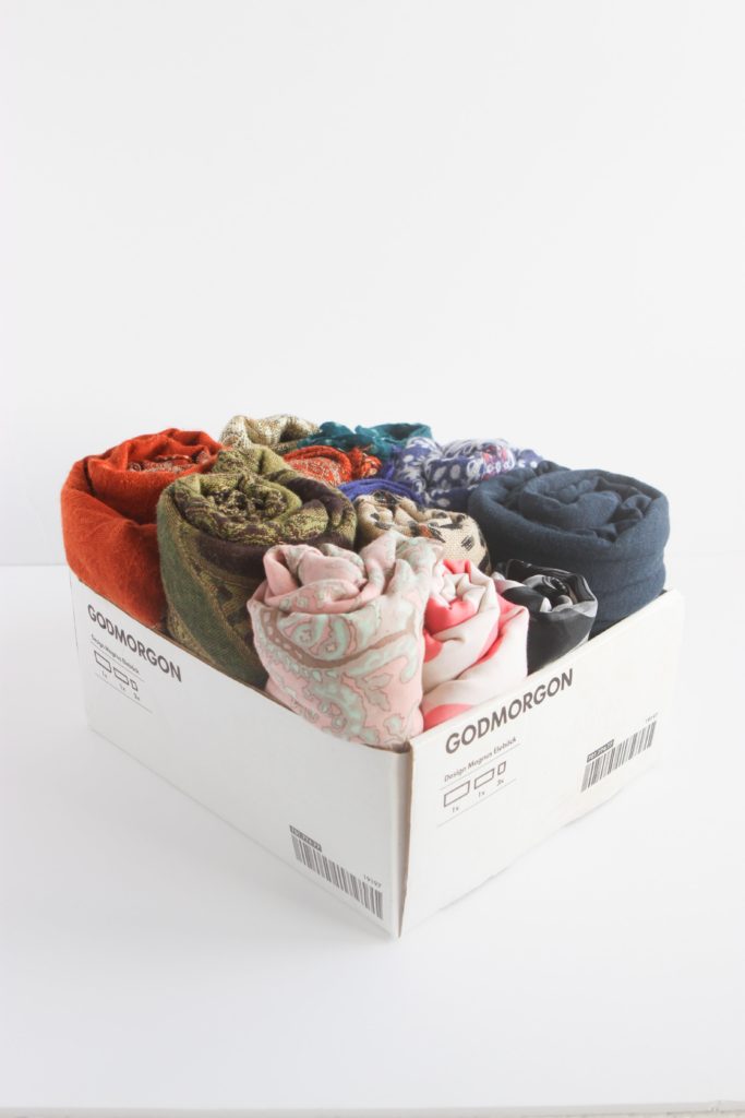 Use product packaging and grocery boxes as clothes storage 